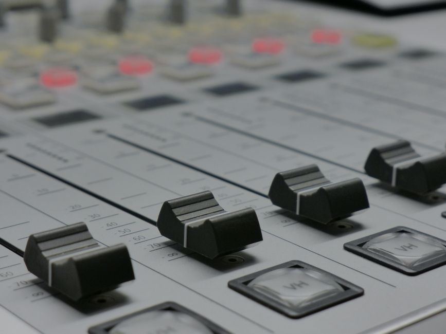 A home recording studio with a small mixing setup.