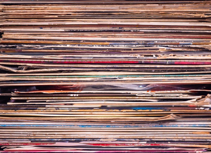 A collection of vinyl records fanned out.